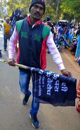 mi Tribal activist carrying black flag the day before Christmas in Jharkhand state India. Morning Star News01 19 2018